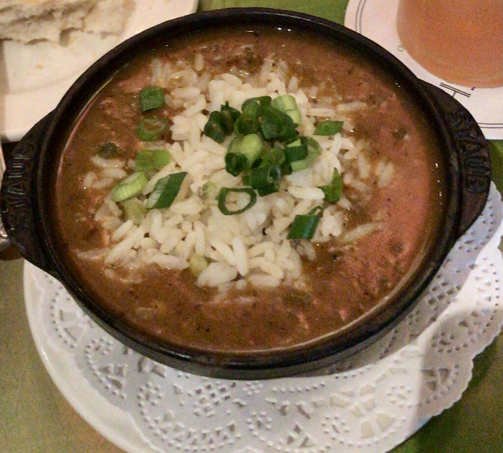 A small cast iron skillet filled with crawfish étouffée
